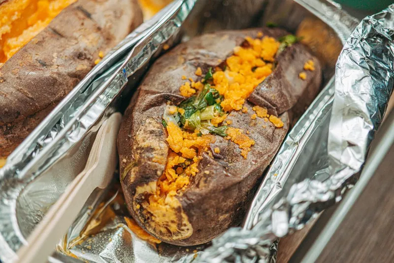 Baked sweet potatoes filled with a savory taco-style topping