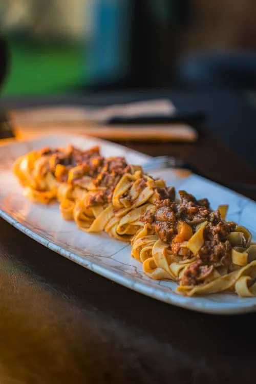 Rich beef and mushroom ragu served over ribbon pasta