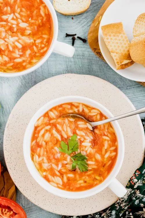 Creamy tomato orzo topped with basil