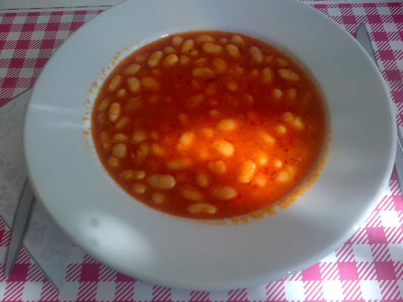 Turkish meatless kuru fasulye with tender white beans in a red tomato broth