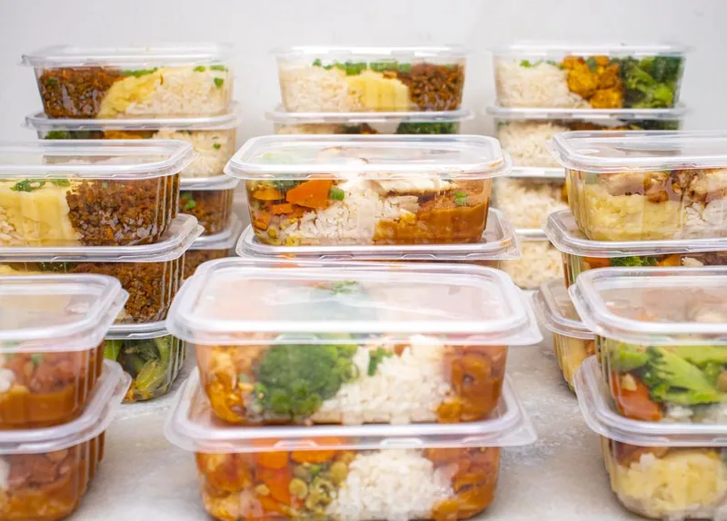 Stacked meal-prep containers filled with balanced meals