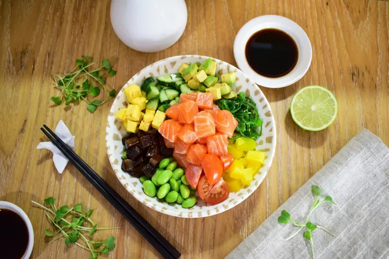 Miso salmon rice bowl with avocado cucumber and edamame